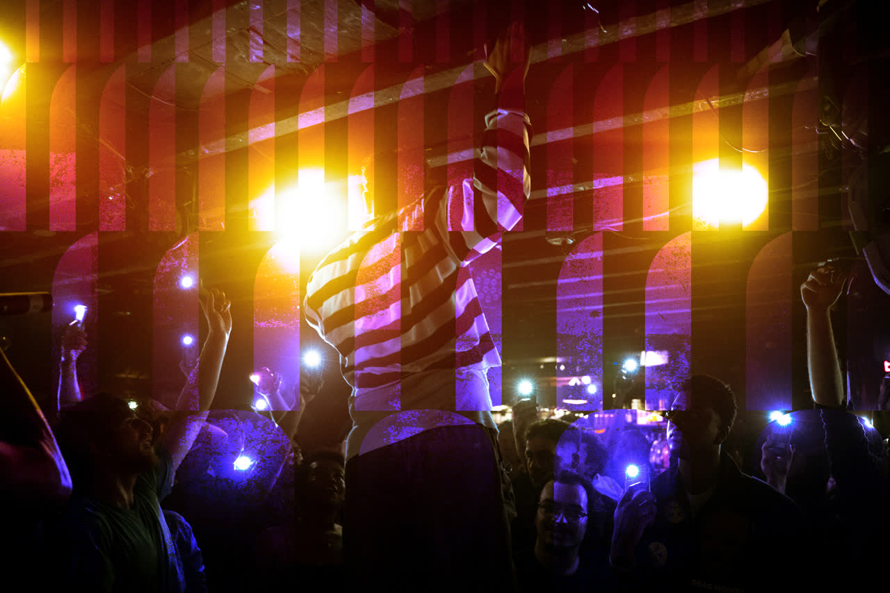 Crowd with phone lights raised at a Dropp club night